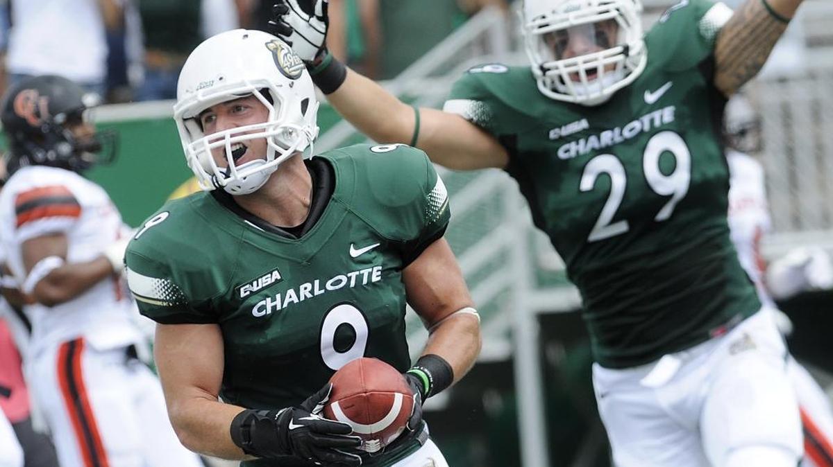
Matt Hogan, now a graduate assistant coach with the Charlotte 49ers’ football team, is best-known for the play – his interception of a Campbell pass on the second play of the 49ers’ first football game. Hogan (9) returned it for a touchdown.



