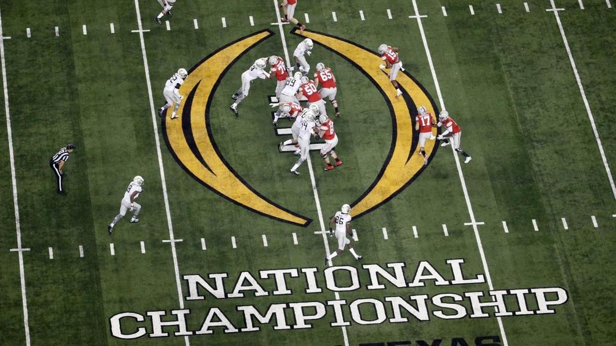FILE - In this Jan. 12, 2015, file photo, Ohio State, right, and Oregon play during the first half of the NCAA college football playoff championship game in Arlington, Texas.