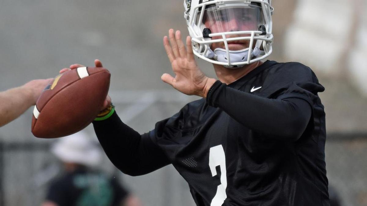 Charlotte quarterback Kevin Olsen (2) winds up to throw a pass during the 49ers first spring practice session, held Saturday, March 19, 2016. Olsen, a transfer from Riverside (Calif.) City College and the younger brother of Carolina Panthers tight end Greg Olsen, was one of five quarterbacks vying for Charlotte’s starting job this season. CREDIT: Bill Kiser/Special to the Observer