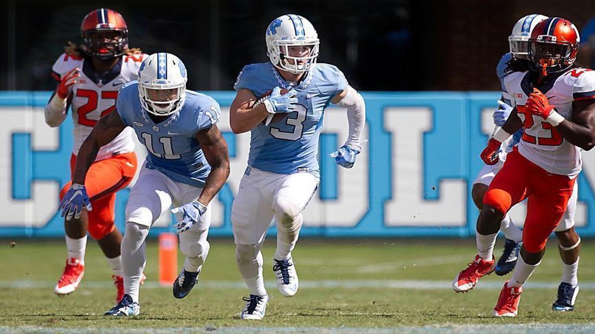 
North Carolina’s Ryan Switzer (3) breaks between Illinois defenders James Crawford (5) LaKeith Walls (22) and Davontay Kwaaning (23) for an 85-yard punt return for a touchdown in the fourth quarter at Kenan Stadium in Chapel Hill.
