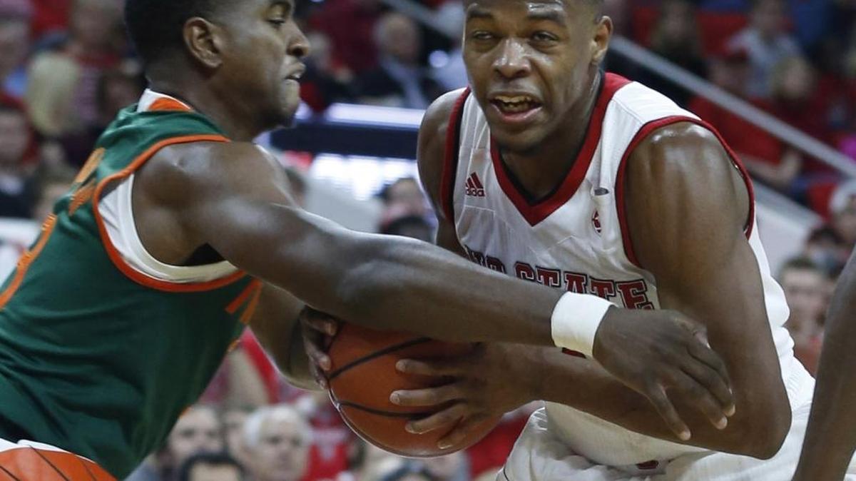 N.C. State point guard Dennis Smith Jr. (right) drives on Miami's Anthony Lawrence Jr. during Saturday’s ACC men’s basketblal game at PNC Arena in Raleigh. Smith, who had 31 points and nine assists against the Hurricanes, will lead the Wolfpack against Florida State on Wednesday.