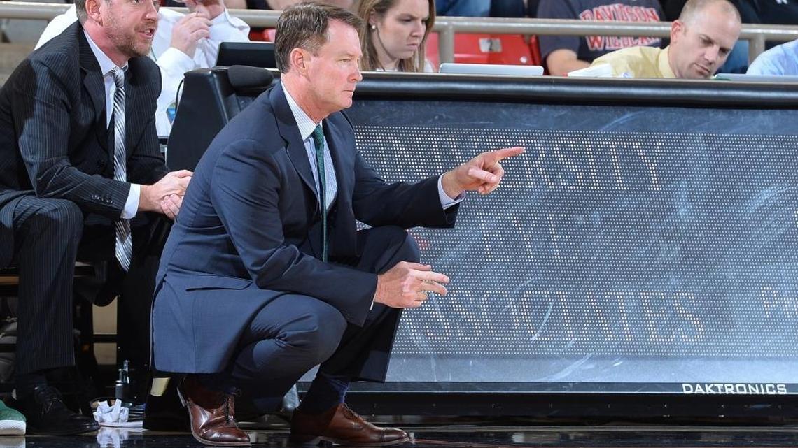 Mark Price (right) was fired by the Charlotte 49ers on Thursday. He will be replaced on an interim basis by assistant Houston Fancher (left).