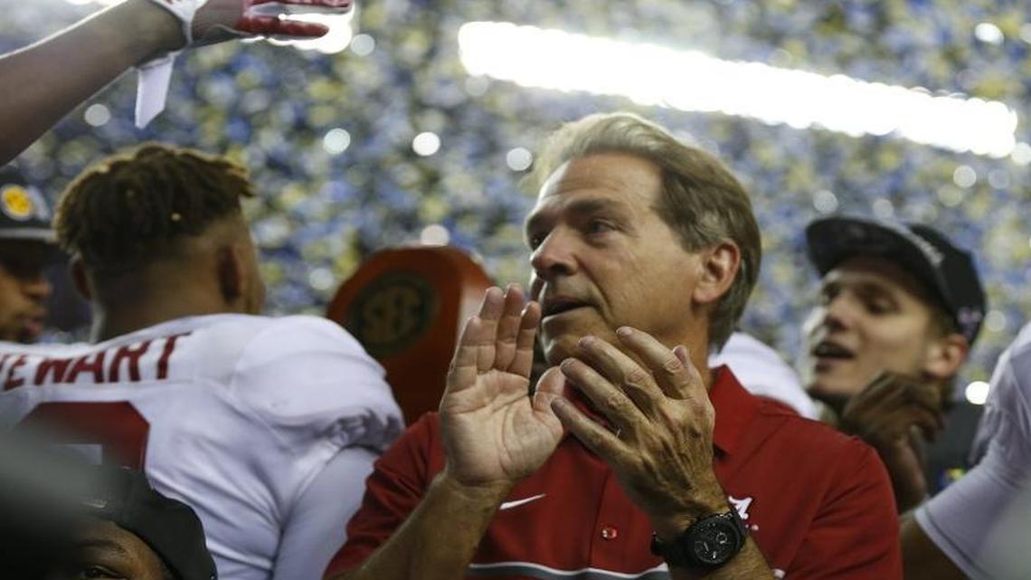 Alabama coach Nick Saban, center, has called Clemson’s Deshaun Watson college football’s best player since Cam Newton.