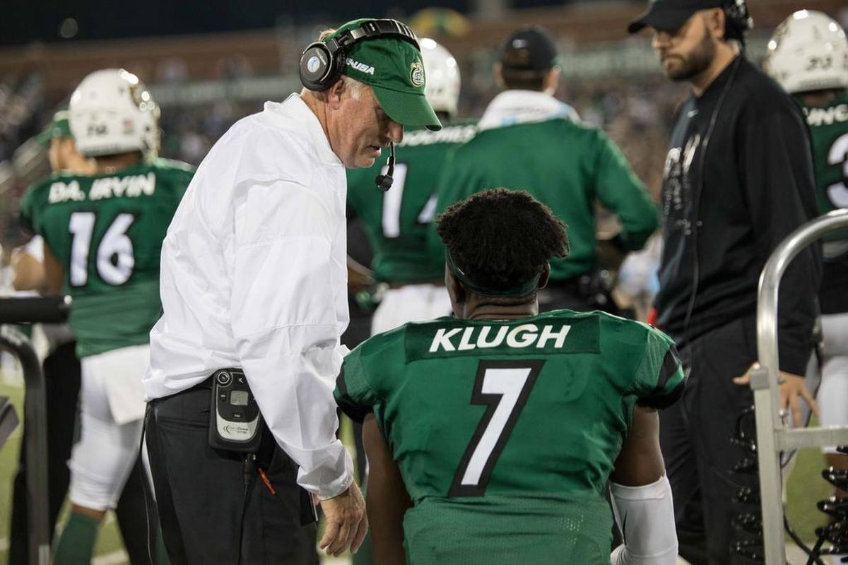 Charlotte 49ers quarterback Haasaan Klugh’s status for the Middle Tennessee game is unknown. Above, 49ers coach Brad Lambert and Klugh (7) talk on the sideline during the 25-24 overtime win against Ala.-Birmingham.