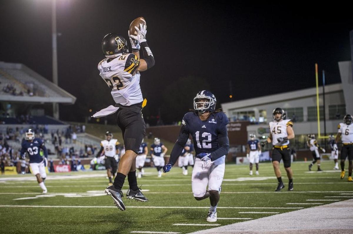 Appalachian State cornerback Clifton Duck intercepts a pass in a game at Georgia Southern last season. He finished the season with five picks.