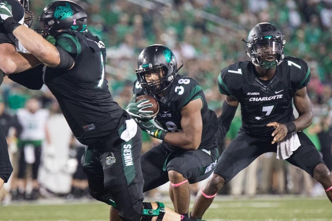 Charlotte 49ers running back Aaron McAllister (38) looks for room upfield in Saturday’s 14-3 loss to the Marshall Thundering Herd at Richardson Stadium.