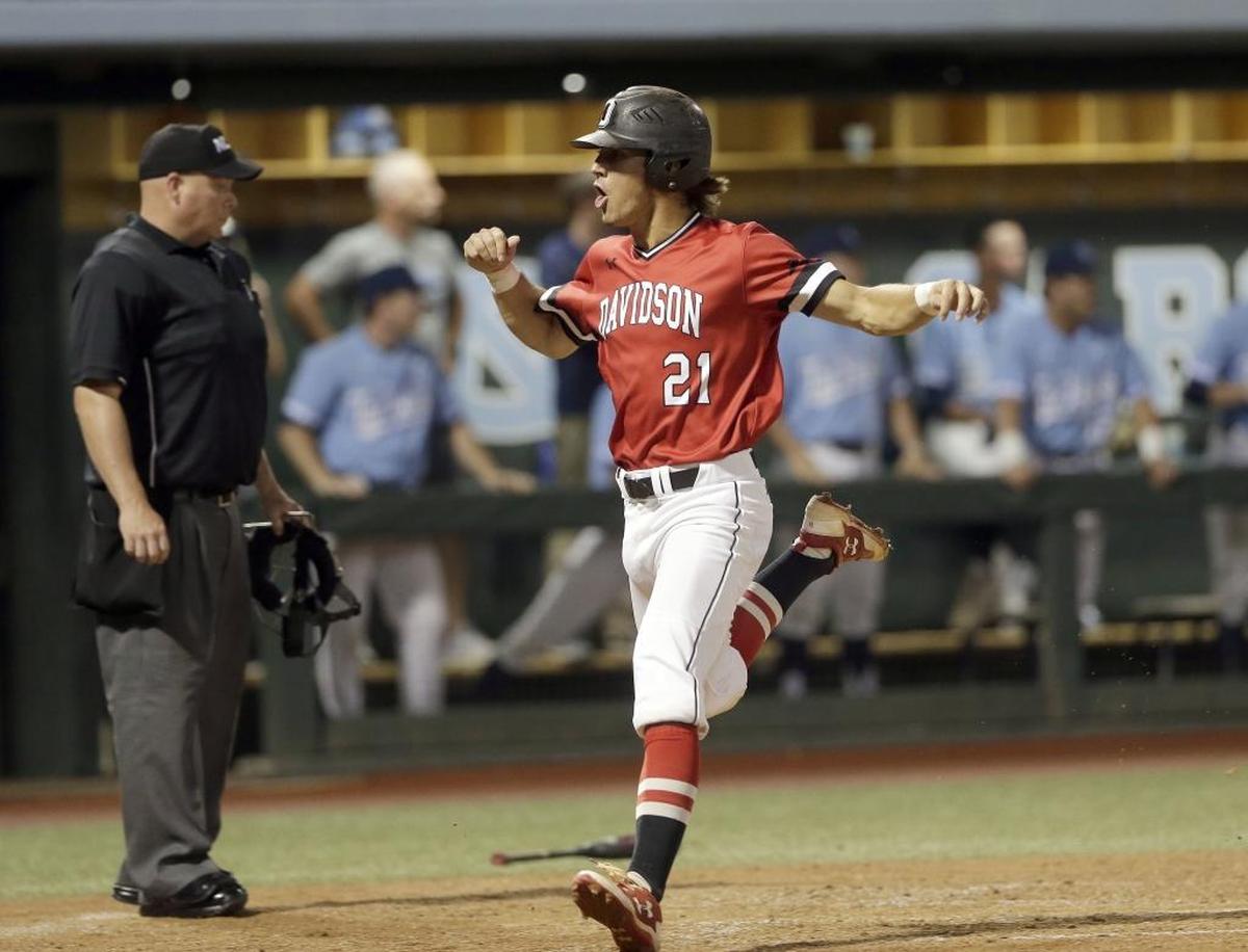 Davidson's Max Bazin crosses home plate to score a run in the fifth inning of Sunday’s NCAA baseball tournament win over Chapel Hill Regional host North Carolina. The Wildcats won 2-1.