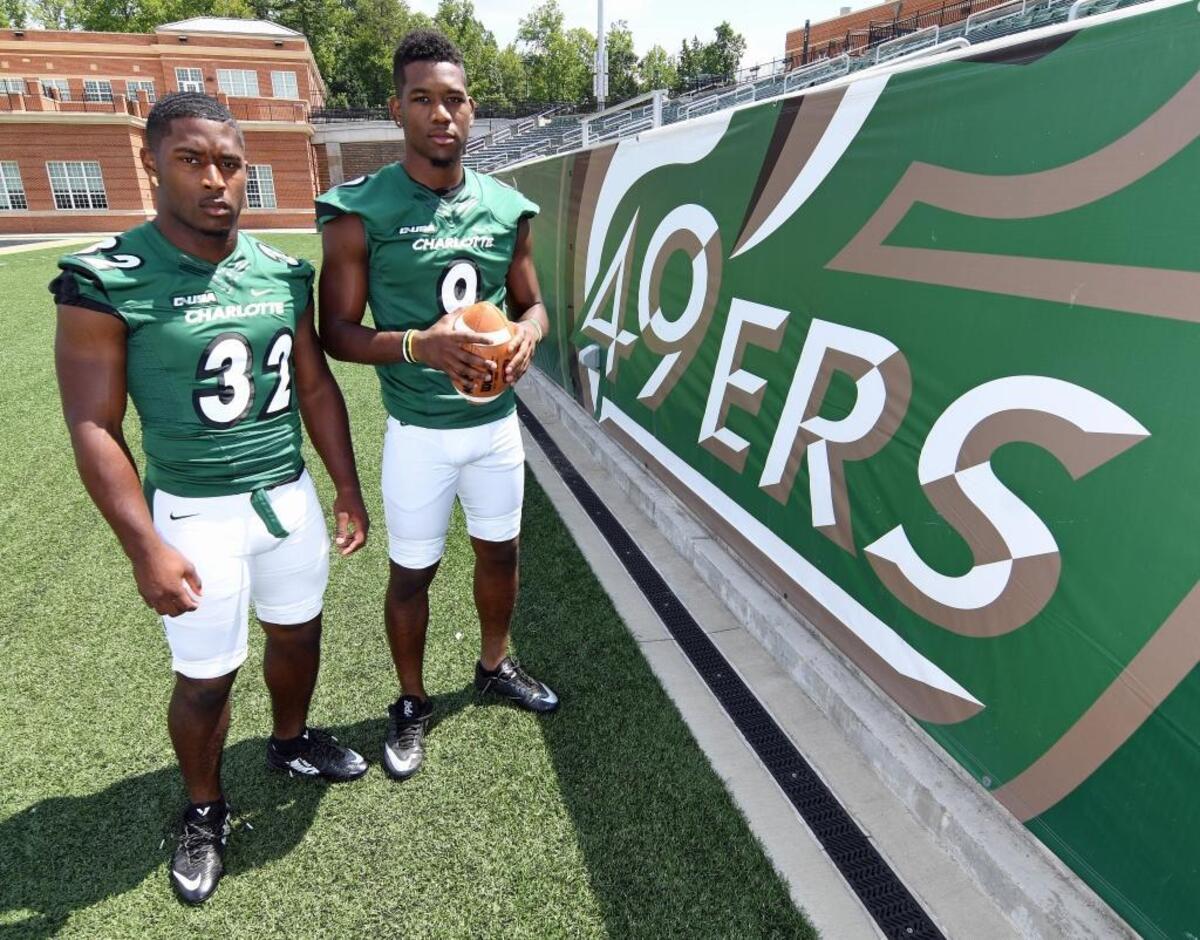 Charlotte running back Benny LeMay (left) and older brother Uriah, a wide receiver, both played for Butler High before signing with the 49ers.