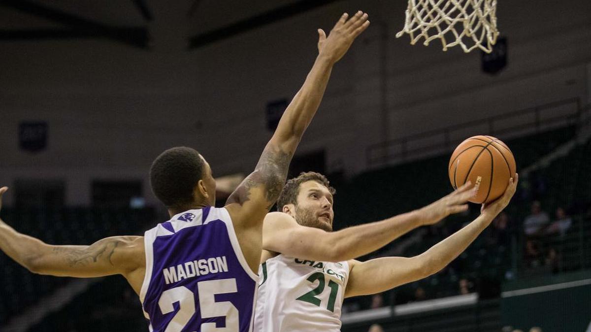 Charlotte senior guard Hudson Price, right, made all four of his field-goal attempts, including a pair of 3-pointers, on his way to 17 points. He also had four rebounds.