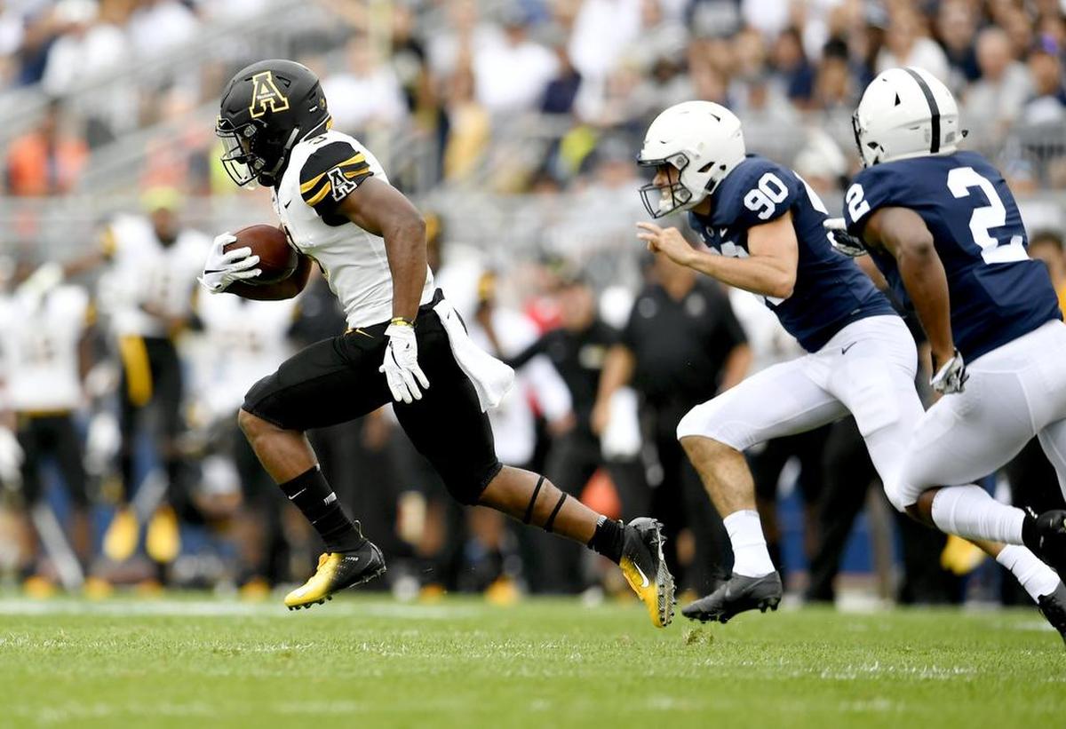 Appalachian State kick returner Darrynton Evans, left, raced 100 yards for a touchdown return against 10th-ranked Penn State last Saturday in the Mountaineers’ 45-38 loss.
