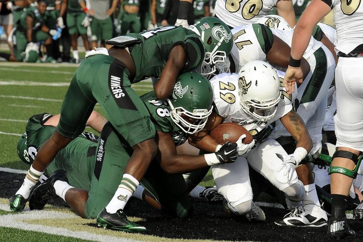 Charlotte 49ers redshirt sophomore running back Akease Rankin (29) scores a touchdown during Saturday’s spring football game at Richardson Stadium.
