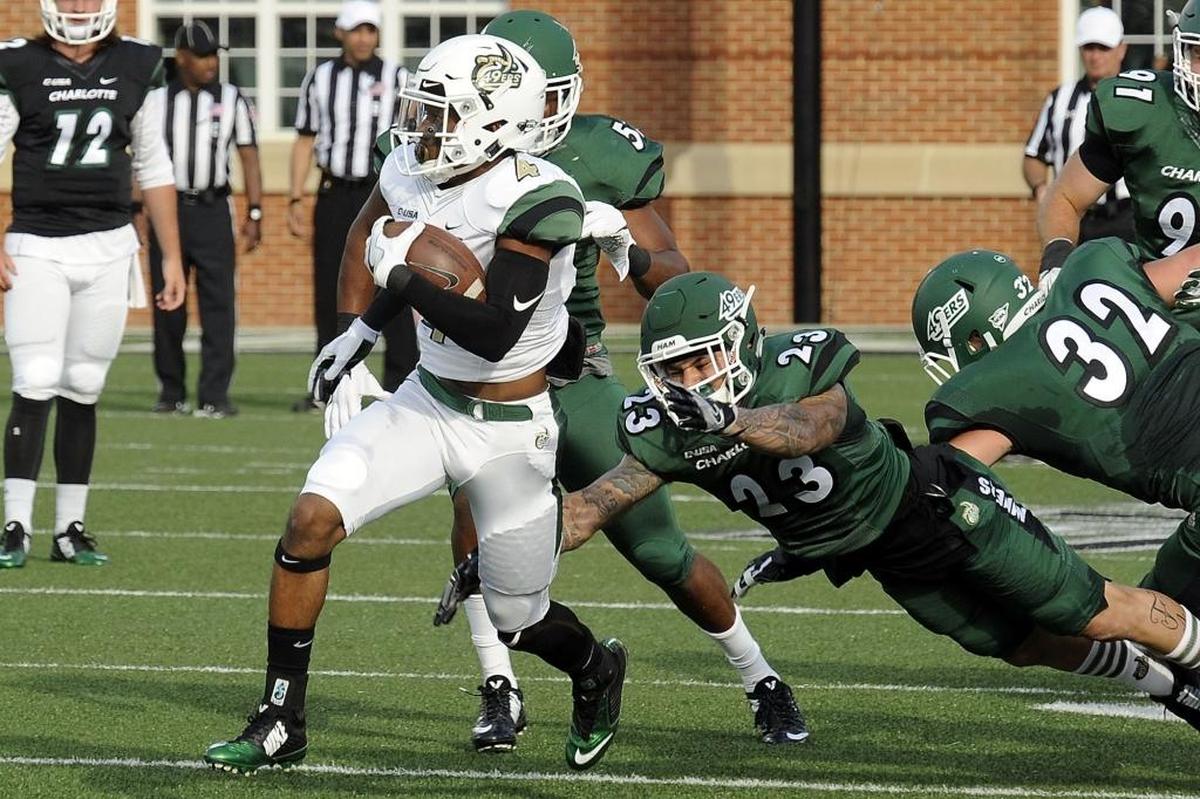 Charlotte 49ers senior wide receiver Chris Montgomery (4) finds some running room during Saturday’s spring football game at Richardson Stadium