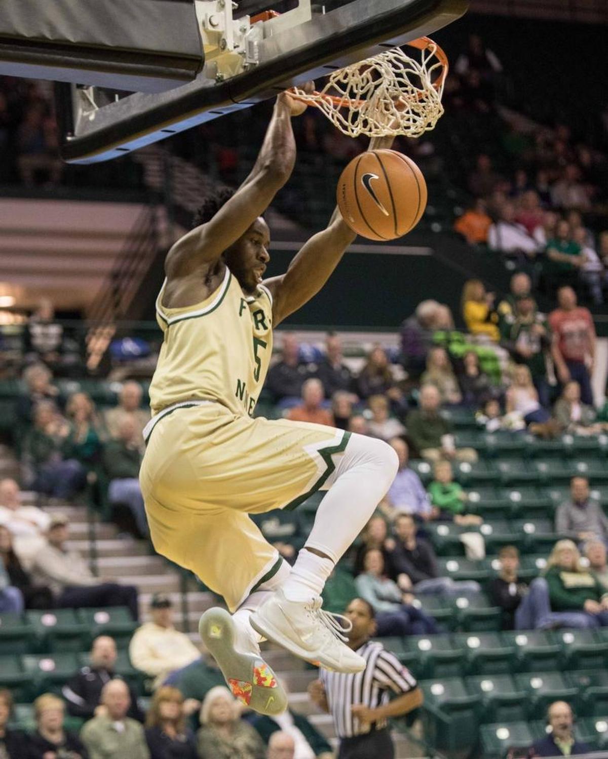 Charlotte 49ers senior guard Austin Ajukwa, a transfer from Clemson, slams home a breakaway dunk in Saturday’s game against Florida Atlantic.
