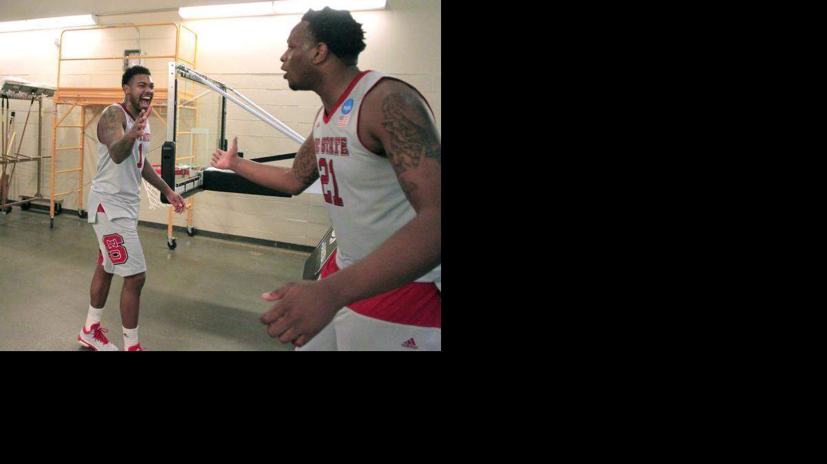 
N.C. State's Trevor Lacey, left, congratulates BeeJay Anya after the Wolfpack’s 66-65 victory over LSU in the second round of the NCAA Division I Men's Basketball Tournament at the Consol Energy Center in Pittsburgh.
