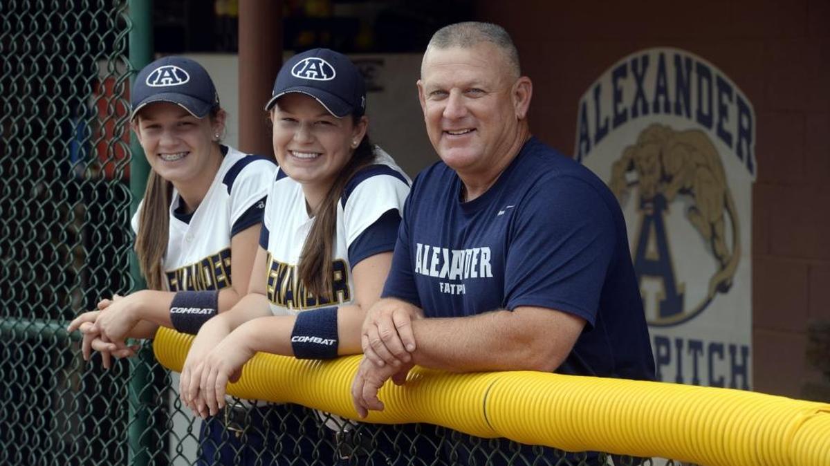 Pfeiffer first-year softball coach Monte Sherrill, right, shown in 2014 while the coach at Alexander Central High School, where daughters Vada, left, and Bailey were standout players. They’ve since joined their father at Pfeiffer.
