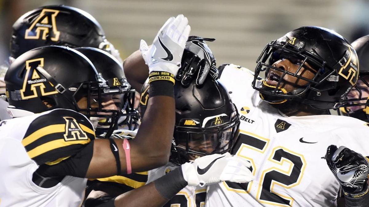 Appalachian State running backs Marcus Cox rushed for 140 yards and Jalin Moore, above center, added 111 as the Mountaineers took home a 37-7 victory at New Mexico State on Saturday.