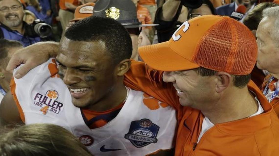Clemson coach Dabo Swinney (right) celebrates with quarterback Deshaun Watson after the Tigers beat Virginia Tech Saturday for the ACC championship.