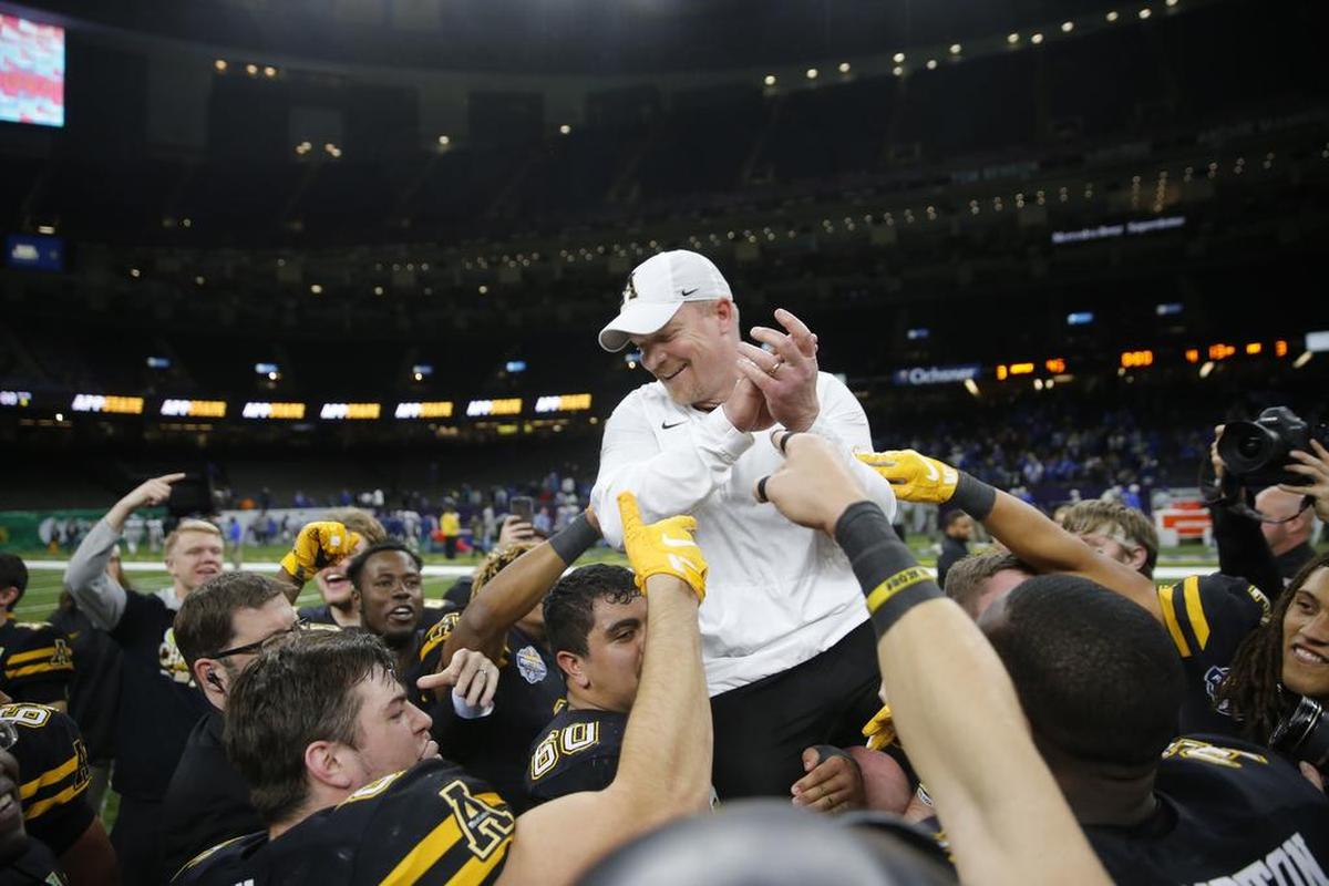 Appalachian State players carry interim head coach Mark Ivey after their 45-13 victory over Middle Tennessee in the New Orleans Bowl on Saturday night.