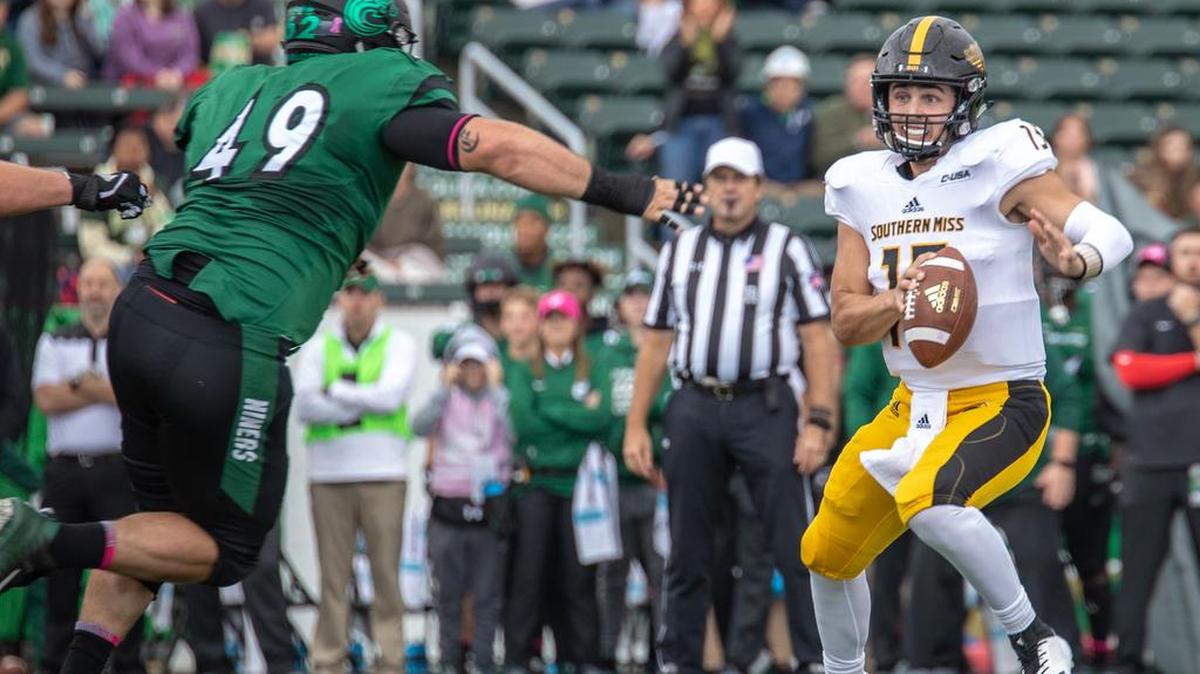 Southern Miss quarterback Jack Abraham, who has committed to Missouri, looks to avoid Charlotte 49ers linebacker Jeff Gemmel in a 2018 game in Charlotte