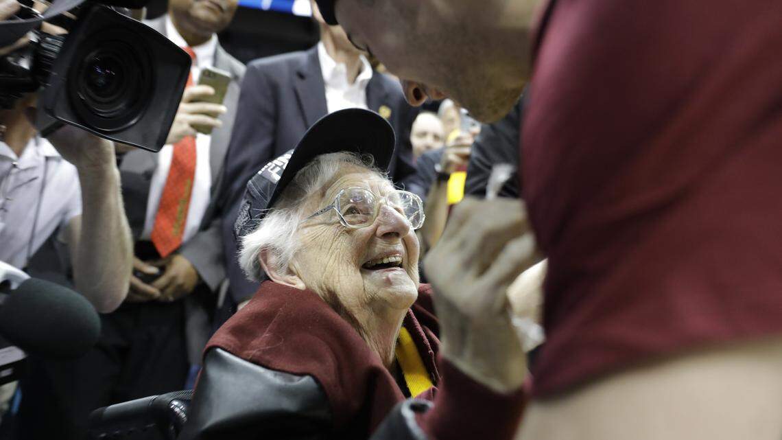 Loyola-Chicago basketball chaplain Sister Jean Dolores Schmidt speaks with Loyola-Chicago guard Ben Richardson after a regional final NCAA college basketball tournament game between Loyola-Chicago and Kansas State, Saturday, March 24, 2018, in Atlanta. Loyola-Chicago won 78-62. (AP Photo/David Goldman)