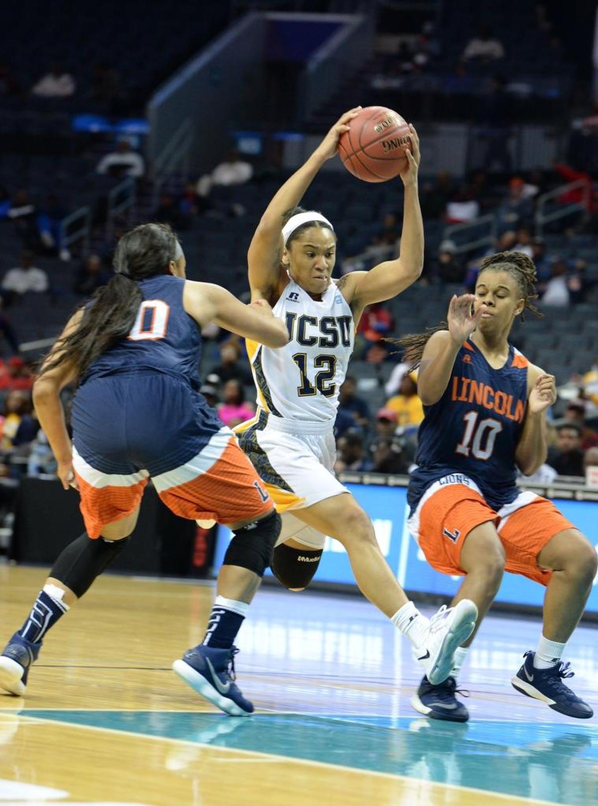 Johnson C. Smith’s Monique Hall (12) makes a move past Lincoln’s Shecquan Bailey (10) during the CIAA women’s basketball tournament quarterfinals at Spectrum Center in March 2018. Lincoln won 58-52 to advance to the semifinals.