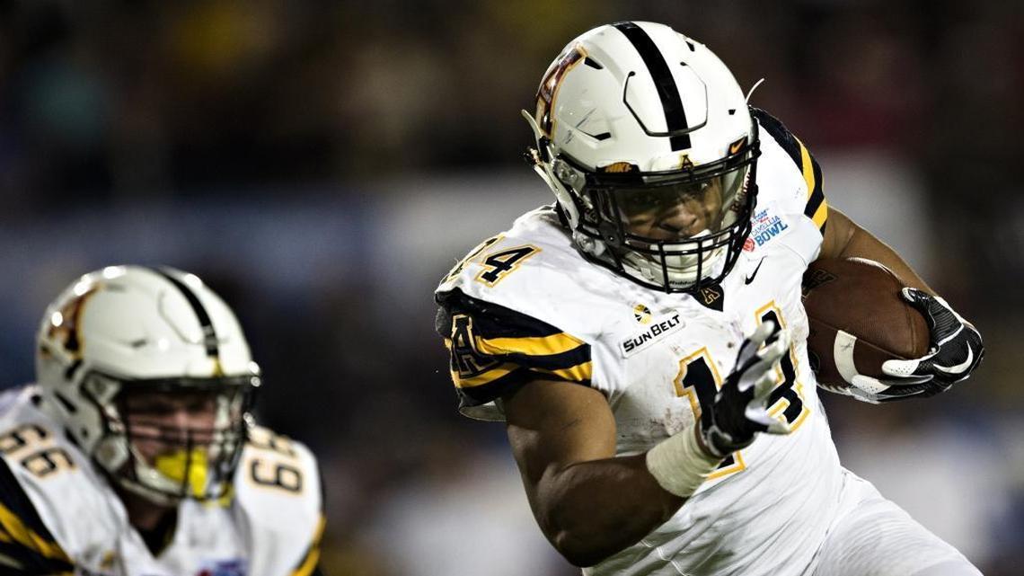 Appalachian State running back Marcus Cox (14) passed 5,000 career rushing yards thanks to a 143-yard effort against Toledo.