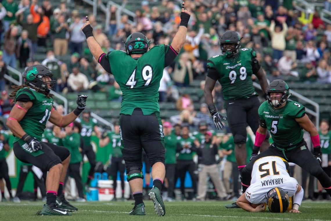 Charlotte 49ers linebacker Jeff Gemmel (49) sacks Southern Miss quarterback Jack Abraham (15) Saturday at Richardson Stadium.