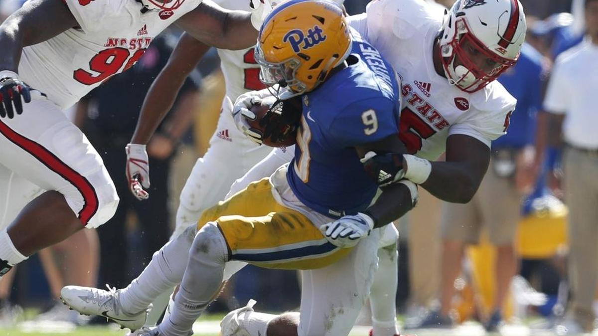 N.C. State's Darian Roseboro (45) tackles Pitt's Michael Smith (9) during the second half of N.C. State's 35-17 victory over Pittsburgh at Heinz Field in Pittsburgh, Pa., Saturday, Oct .14, 2017.