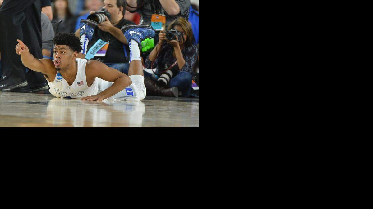 
Duke guard Quinn Cook  points for the Blue Devils to have possession against Utah on Friday night. Duke beat Utah, 63-57, in the semifinal of the NCAA South Region, Friday, March 27, 2015 at the NRG Stadium in Houston.
