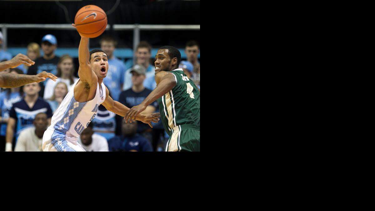 
UNC's Marcus Paige (5) steals the ball from UAB's Robert Brown (4) during their game on Saturday, December 27, 2014 at the Smith Center in Chapel Hill, N.C. 
