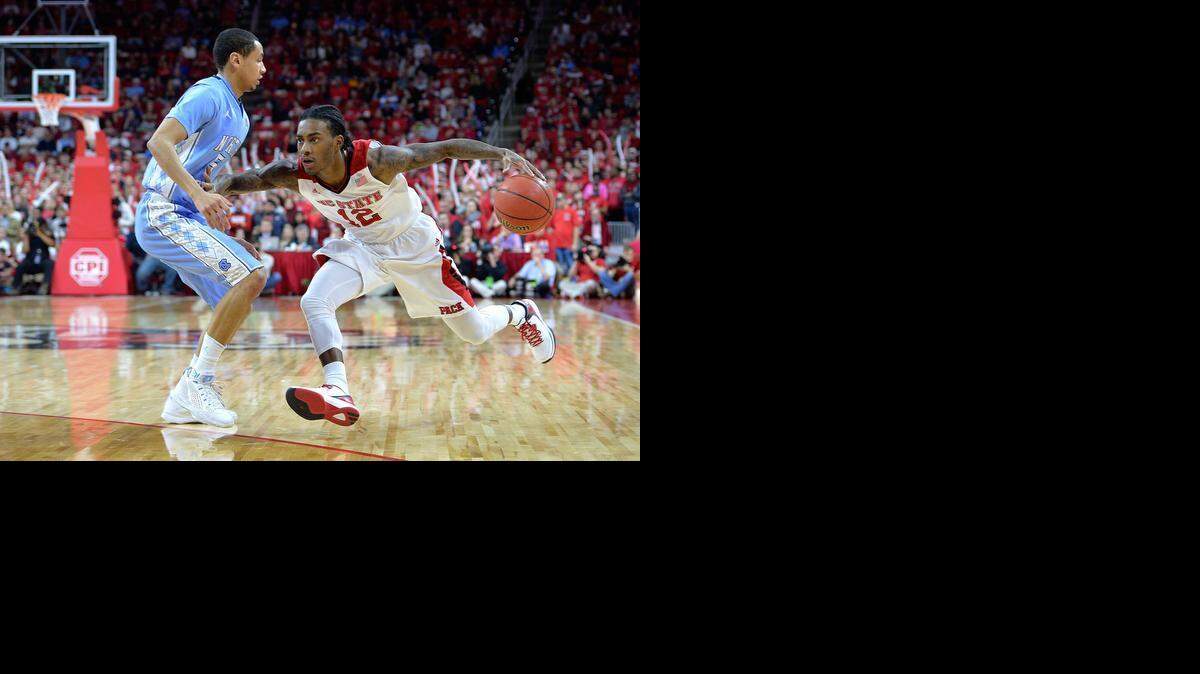 
N.C. State’s Cat Barber runs up against North Carolina’s Marcus Paige during their Jan. 14 game  at PNC Arena  in Raleigh.
