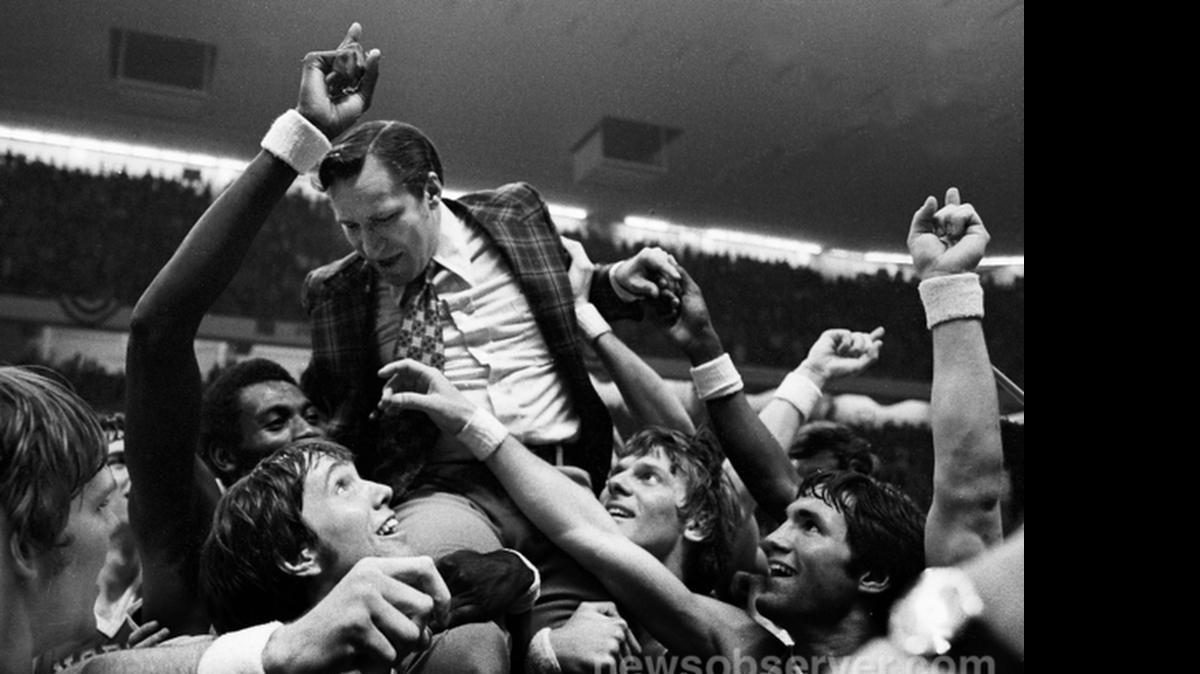 
North Carolina players hoist Dean Smith after the Tar Heels’ victory in the ACC tournament championship game in 1972. Earlier that season, UNC’s tradition of the road homecoming game began.

