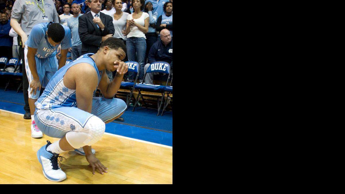 
It might be cliche, but you really can see the agony of defeat in North Carolina’s Nate Britt, left, and Kennedy Meeks as time expires in the Tar Heels’ 92-90 overtime loss Wednesday at Duke.

