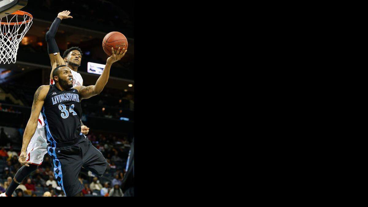 
Livingstone forward Eric Mayo (34) shoots against Winston-Salem State in the CIAA championship game at the Time Warner Cable Arena. Livingstone won 106-91. (Nell Redmond photo) 
