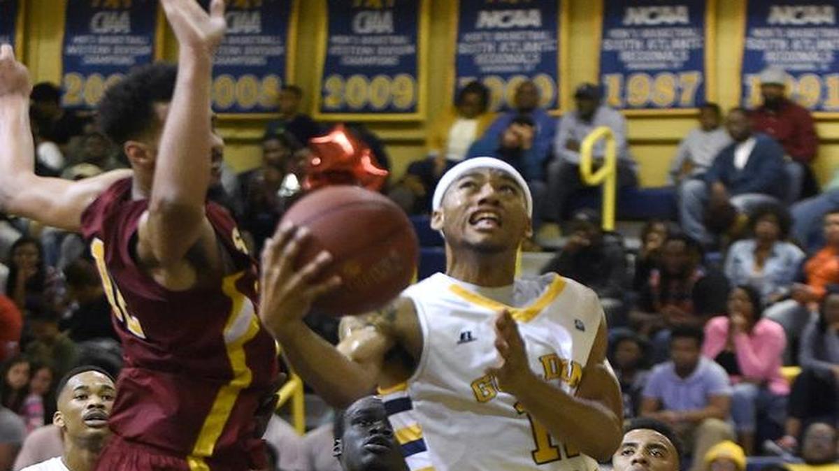 JCSU’s Diondre Pratt (12), a 6-foot-4 senior guard, shoots against Shaw on Feb. 20.
