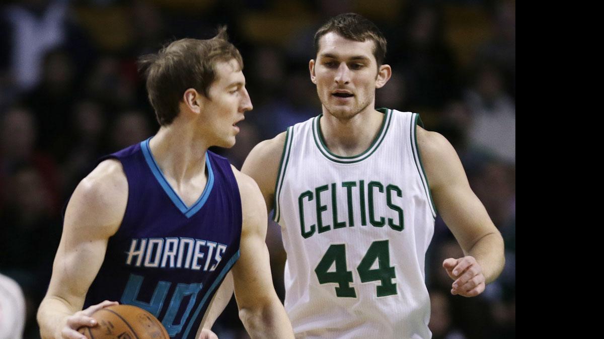 
Boston Celtics center Tyler Zeller (44) defends his brother, Charlotte Hornets center Cody Zeller (40) during  an NBA game in Boston, Jan. 5, 2015. 
