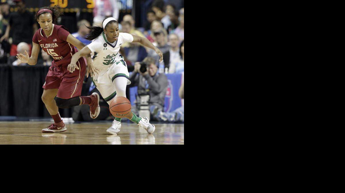 
Notre Dame’s Jewell Loyd and Florida State’s Maegan Conwright battle for the ball during the first half the ACC championship game Sunday at Greensboro Coliseum. Top-seeded Notre Dame beat second-seeded FSU 71-58, and Loyd led the way with 18 points.
