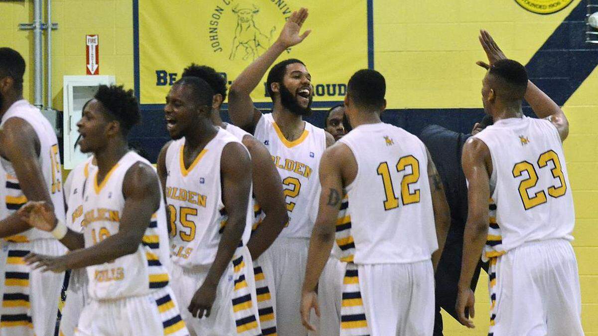 JCSU's Christian Williams (32) and Stedmon Lemon (23) rejoice after the Bulls 66-64 win against Wingate on Saturday.