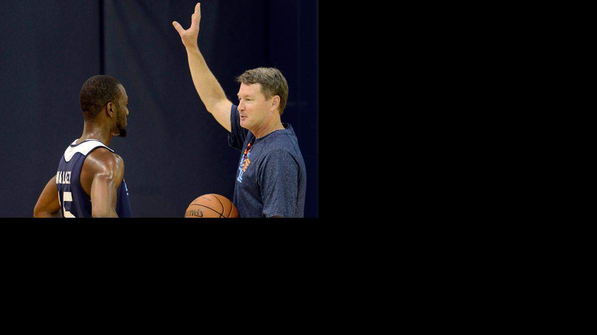 
Mark Price, right, works with Kemba Walker (15) during a practice at Time Warner Cable Arena on July 9, 2013. The Charlotte 49ers will introduce former NBA great and Charlotte Hornets assistant Price, 51, on Thursday as their new head basketball coach. 
