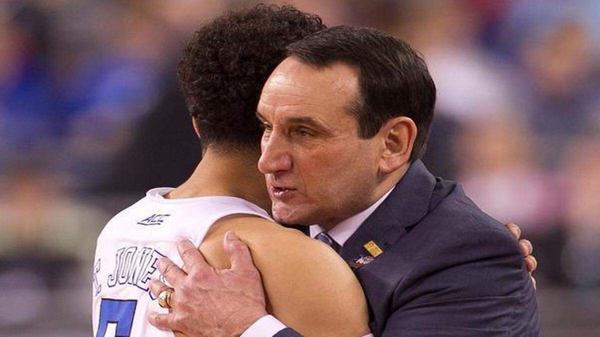 
Duke coach Mike Krzyzewski embraces Tyus Jones (5) in the closing minutes against Michigan State in the NCAA semifinals, Saturday April 4, 2015 at the Lucas Oil Stadium in Indianapolis.
