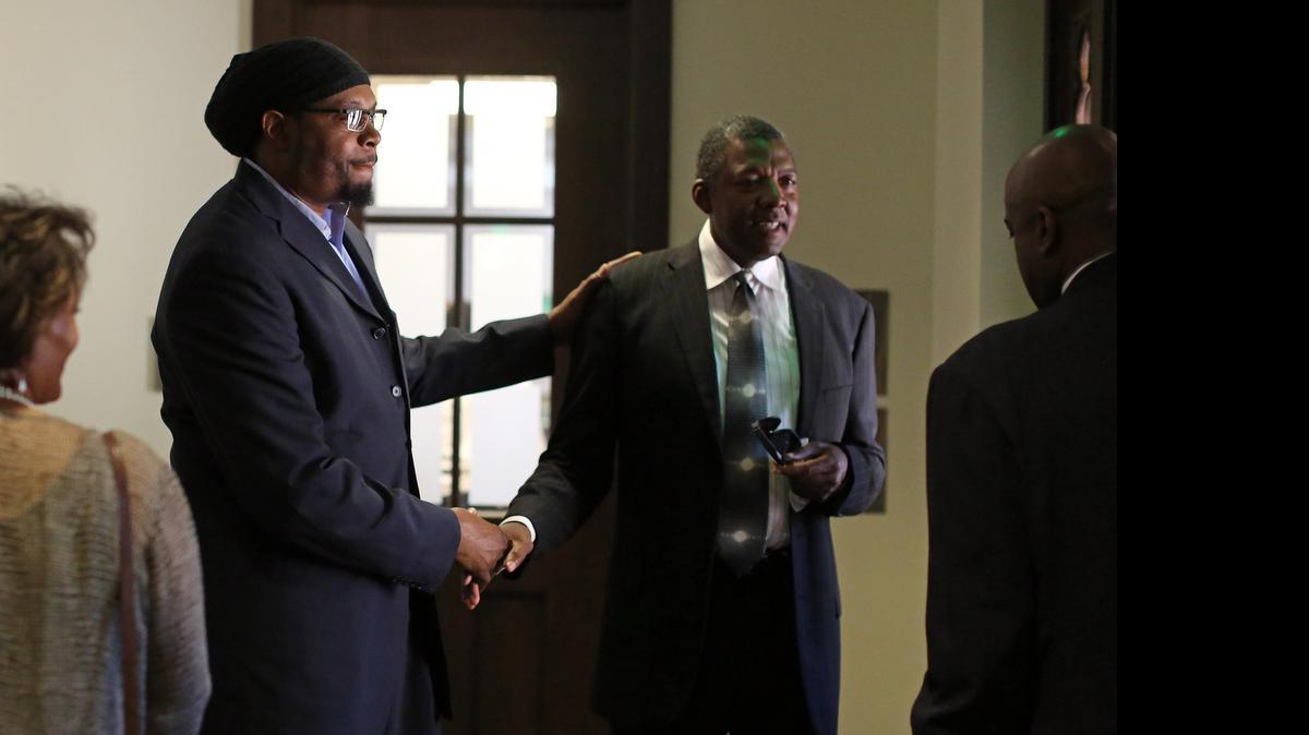 
Sam Perkins, a UNC basketball player from 1980 to 1984, left, speaks with former player Al Wood (1977-81) after the funeral for former Tar Heels coach Bill Guthridge on Monday at the Chapel of the Cross Episcopal Church in Chapel Hill.

