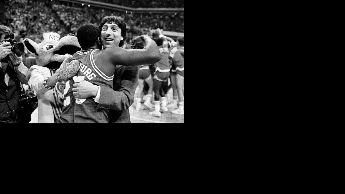 
N.C. State head coach Jim Valvano embraces Dereck Wittenburg as the Wolfpack celebrates their 1983 ACC Tournament championship.
