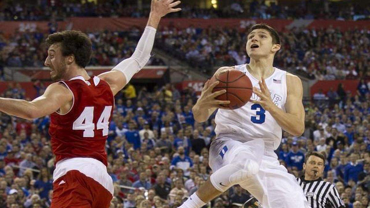 
Duke’s Grayson Allen  drives to the basket against Wisconsin’s Frank Kaminsky  during the NCAA championship game in Indianapolis.
