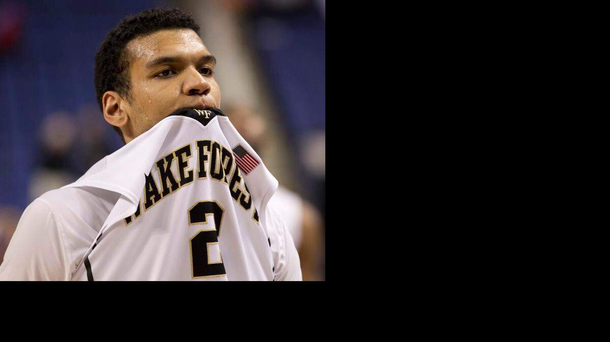
Wake Forest's Devin Thomas reacts after the Deacons lost 81-80 to Virginia Tech in the first round of the ACC tournament at the Greensboro Coliseum on Tuesday. .
