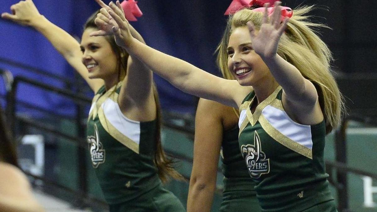 Charlotte 49ers cheerleaders perform during the Charlotte 49ers' annual Basketball Madness at Halton Arena.
