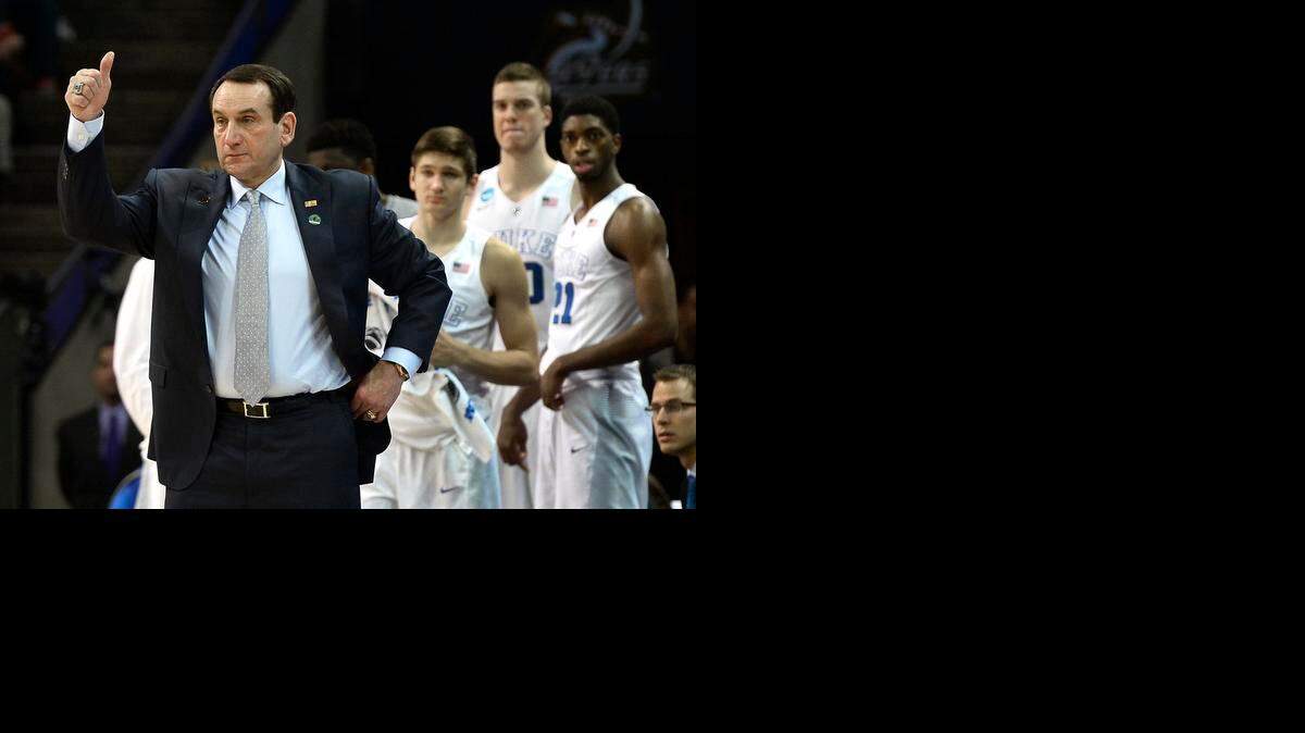 
Duke head coach Mike Krzyzewski gives his team the thumbs up vs. San Diego State on Sunday during an NCAA third-round game at Time Warner Cable Arena in Charlotte. Duke defeated San Diego State 68-49.
