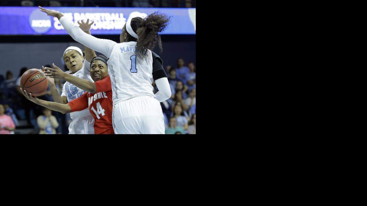 
North Carolina’s Allisha Gray, left, and Stephanie Mavunga, right,  defend as Ohio State’s Ameryst Alston drives to the basket Monday night during the first half of an NCAA tournament  second-round game  in Chapel Hill.
