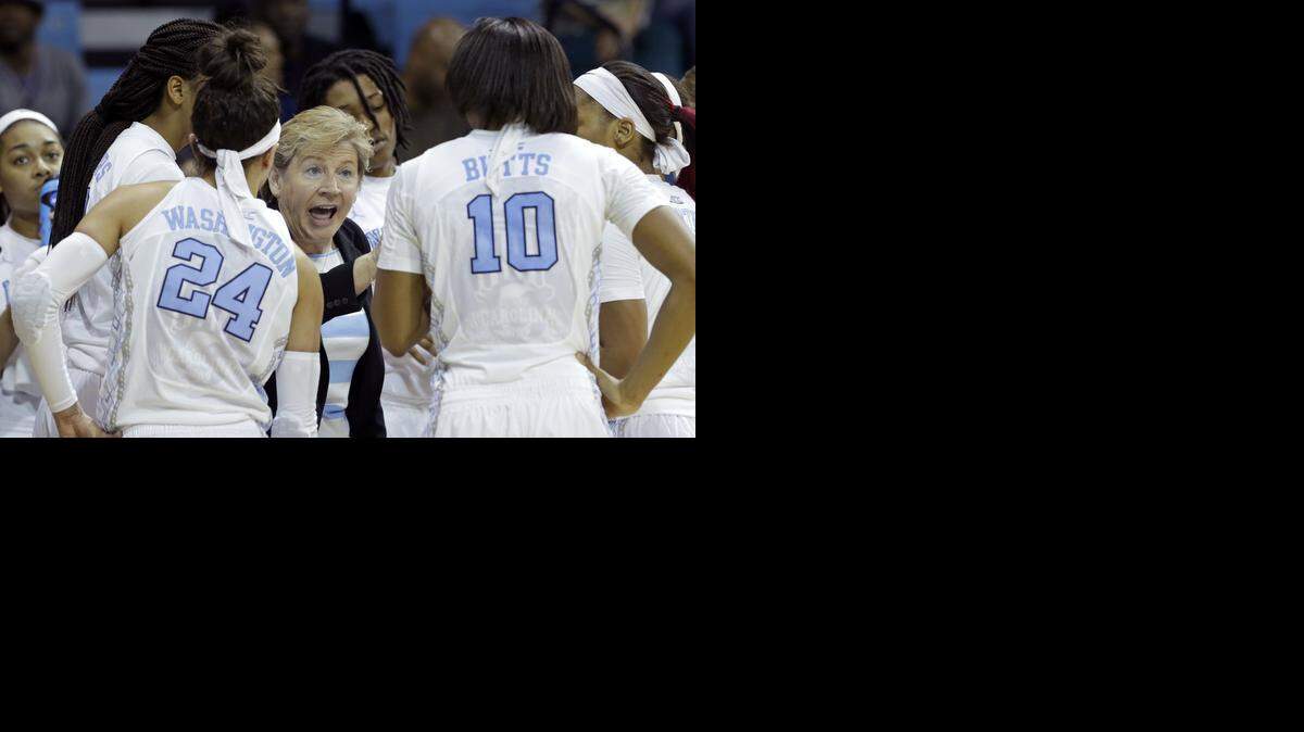 
North Carolina coach Sylvia Hatchell speaks with her players during a timeout in the second half of a women's college basketball game against Liberty in the first round of the NCAA tournament in Chapel Hill, N.C., Saturday, March 21, 2015.
