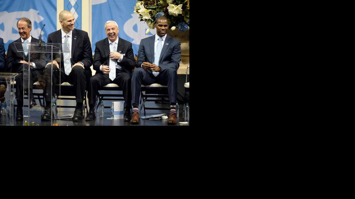 
Erskine Bowles, left, laughs with former North Carolina player Eric Montross, current North Carolina coach Roy Williams and former player Antawn Jamison while on stage at the Dean E. Smith Center during the public memorial service for Dean Smith on Sunday.
