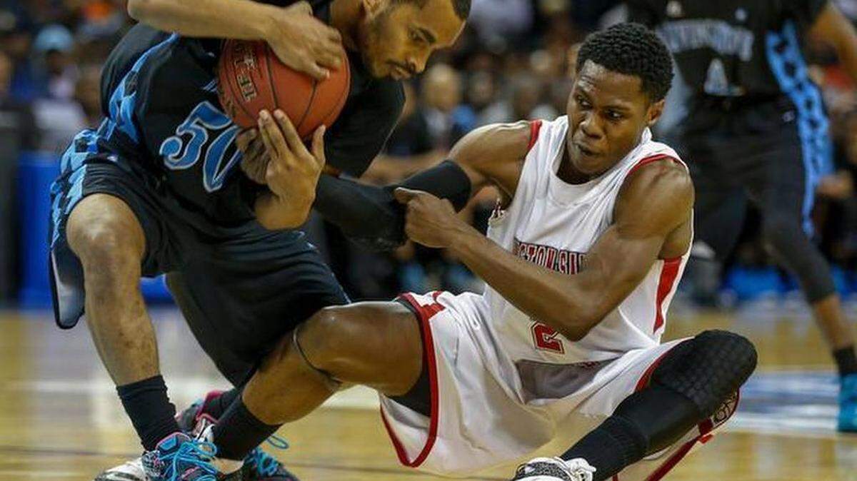 2015 FILE PHOTO: Livingstone guard Daryl Traynham, left, fights Winston-Salem State guard Terrell Leach for a loose ball in the second half of the CIAA championship game at the Time Warner Cable Arena. Livingstone won 106-91. (Nell Redmond photo)